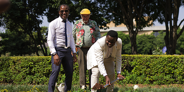 LtoR Wits Vice Chancellor Prof Zeblon Vilakazi, Ludwig Taschner director Ludwigs Rose Farm and Cebolenkosi Khumalo SRC president plant the Wits rose commissioned for the University's centenary